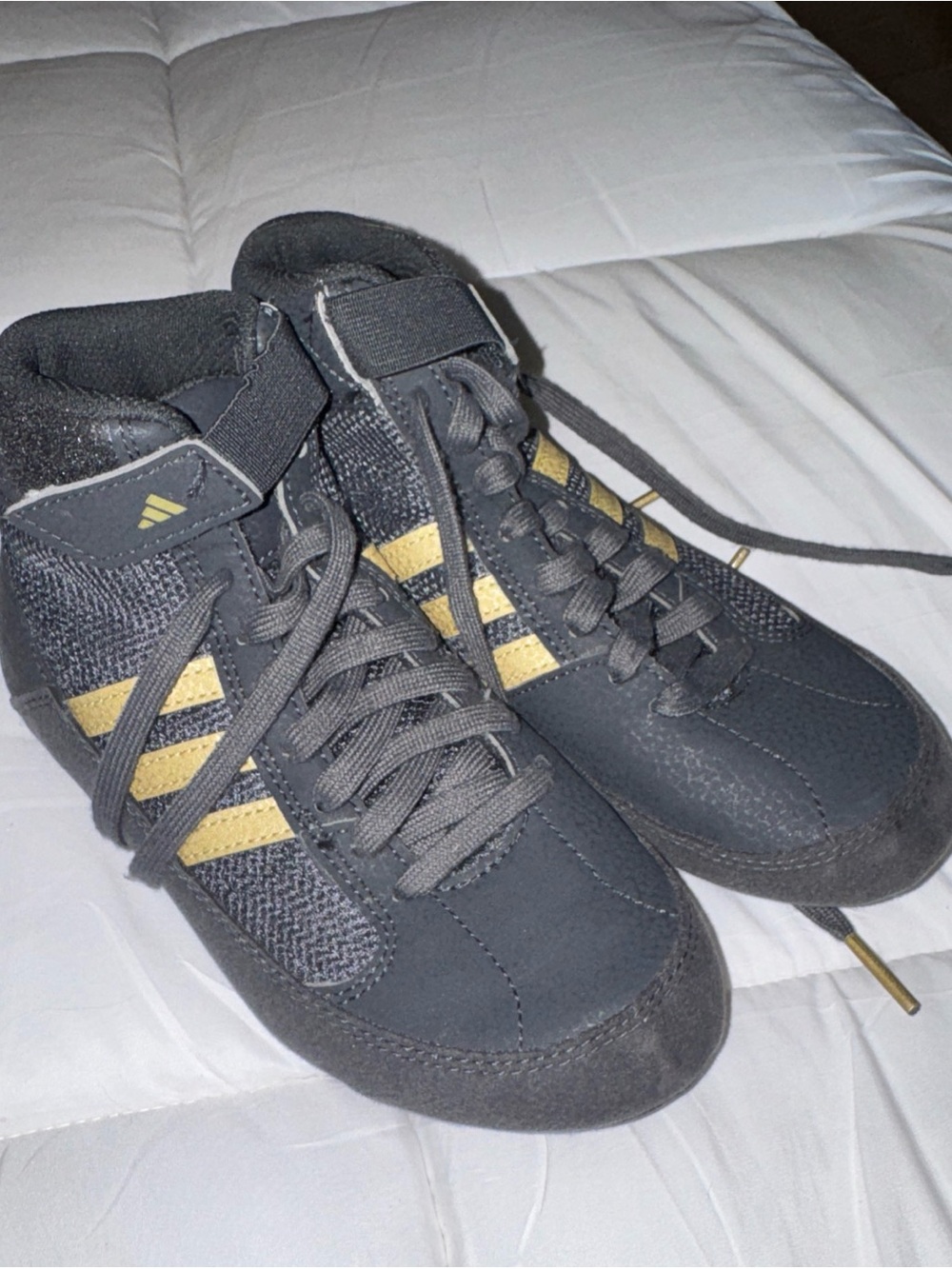 adidas Men’s Black High-Top Sneakers with Gold Stripes